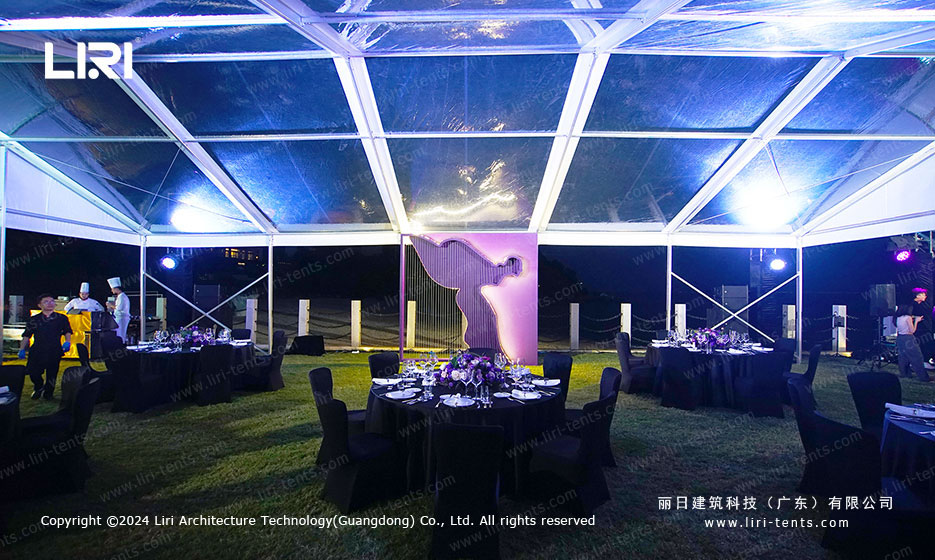 Guests enjoying fine dining while viewing brand displays inside the Liri Tent party venue
