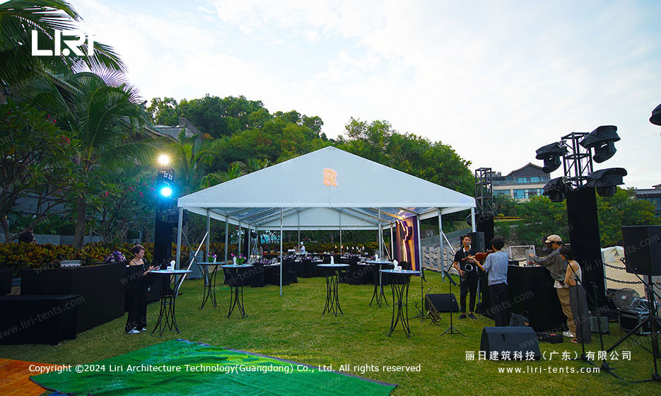 Large customizable banner with brand elements on the transparent party tent exterior